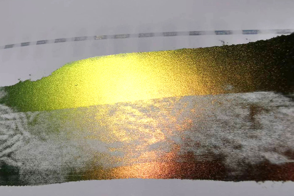 Close-up of a certificate showing the color-shifting effect of Optically Variable Ink (OVI).