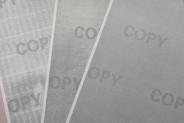 Diagram showing the layers of security paper with fibers and coatings