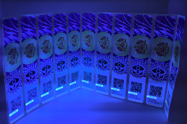 A design team discussing a custom tax stamp layout with national symbols