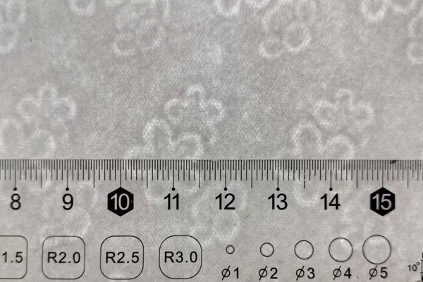 A close-up of security paper features like watermarks and fibers