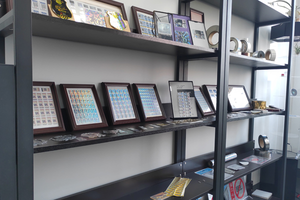 A tax stamp showing a hologram, QR code, and serial number working together